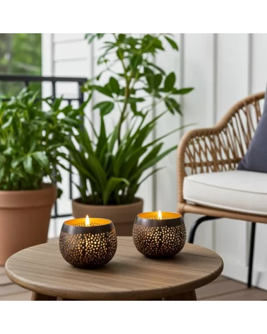 Teelicht & Goldlicht - Teelichtschale Ball gelocht anthrazit-gold 12 cm - zwei Teelichter in Wintergarten auf Tisch