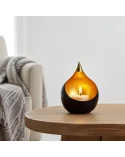 Teelicht & Goldlicht - Teelichschale Bola bronze-gold 15 cm - auf Tisch in Wohnzimmer neben Stuhl