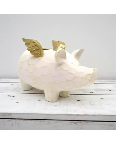 4er-Kerzenständer Schwein weiss-gold aus Holz - für Stabkerzen - auf Ablage vor weisser Wand