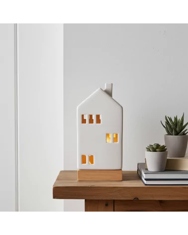 Lichthaus - Teelicht Haus - Dekoration Weihnachten - weiss-glänzend - 22,5 cm auf Ablage neben Büchern beleuchtet