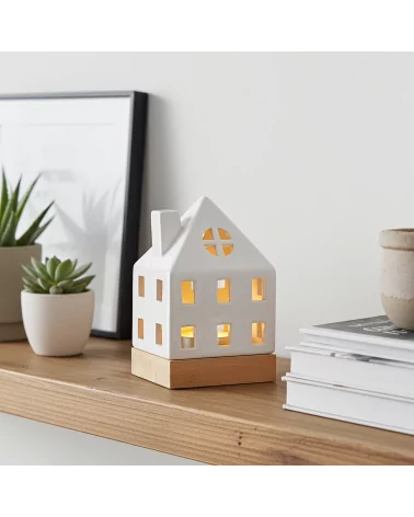 Lichthaus - Teelicht Haus - Dekoration Weihnachten - weiss-glänzend - 17.7 cm auf Ablage neben Büchern